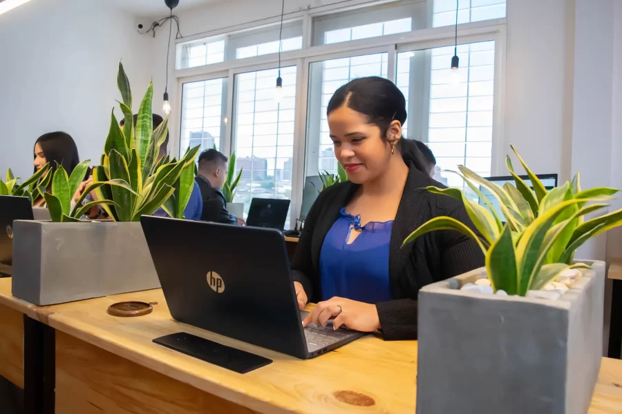 A freelancer working with a computer in a coworking space