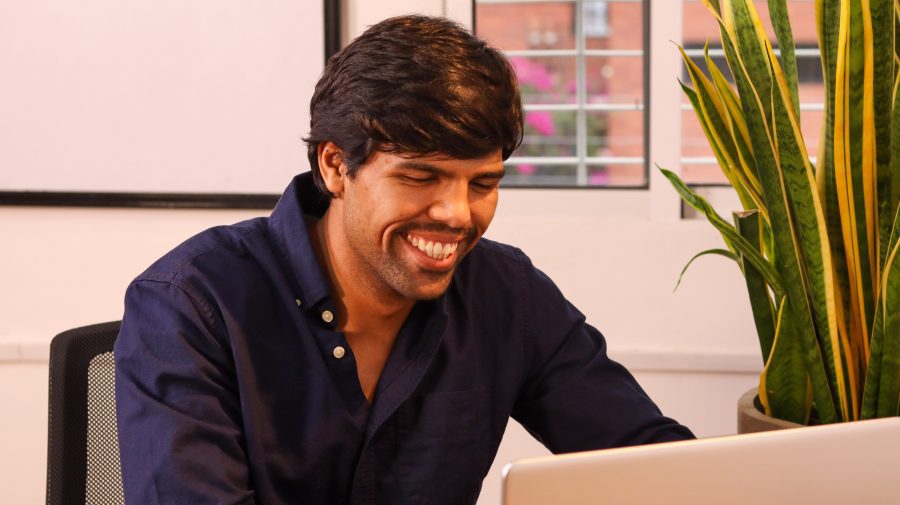Man happily working at a coworking space