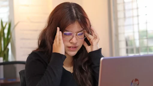 Woman stressed by work in her office.